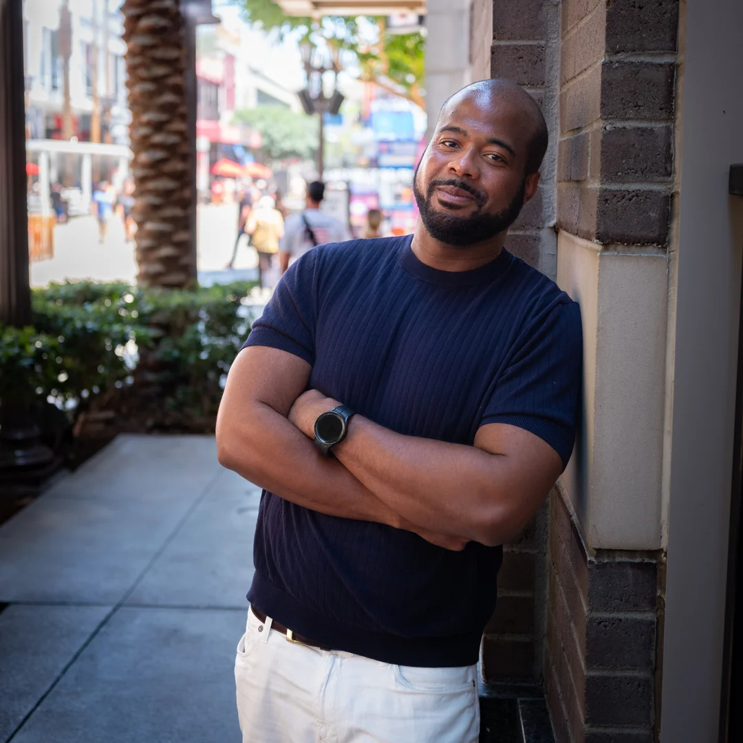 Ringba User Stories - Michael Walker leaning against a wall